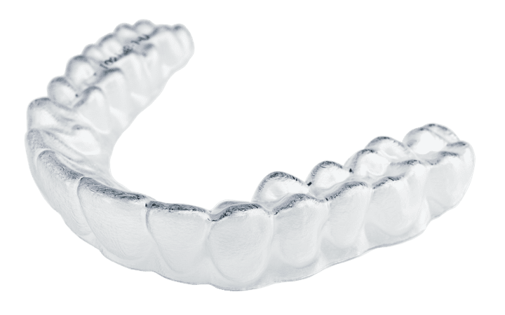 A close-up photo of a customized clear aligner for teeth.